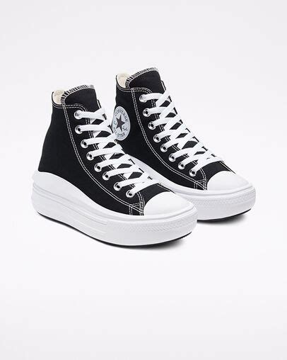 A Pair Of Black And White Converse Sneakers