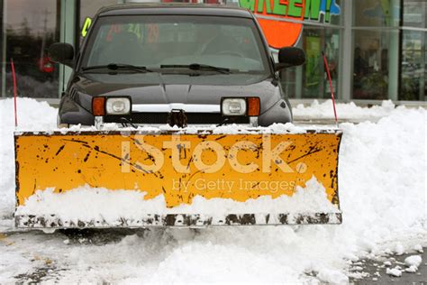 Snow Plow Truck Clearing Parking Lot Stock Photos