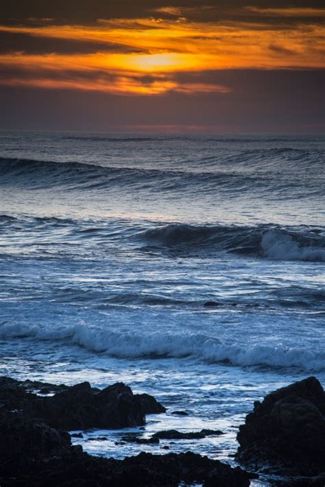 Download 1920x1080 Sunset Horizon Ripples Ocean Sea Waves Clouds