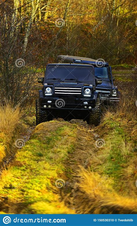 Suv Or Two Black Offroad Cars On Fall Nature Background