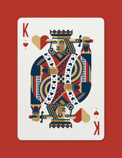 Portrait of young man doing a victory gesture playing poker over. DKNG 'Red Wheel' Playing Cards — DKNG