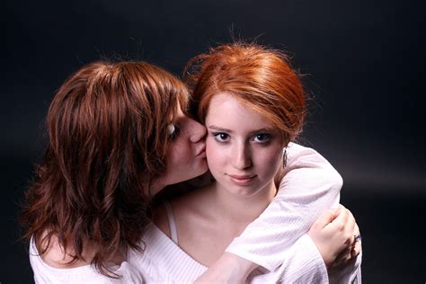 redheaded sisters kissing a redheaded girl embraces and ki… flickr