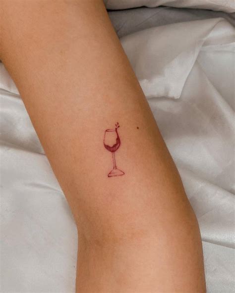 Minimalistic Wine Glass Tattoo Done In Red Ink