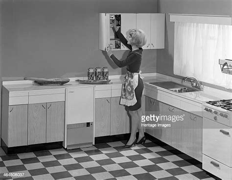 1960s Woman Wearing Apron In Kitchen Photos And Premium High Res