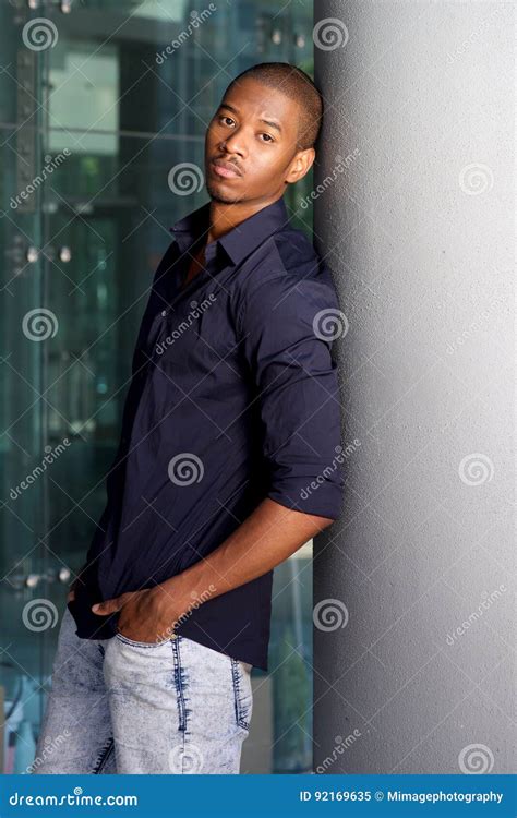 Casual Black Guy Leaning Against Wall Stock Image Image Of Looking