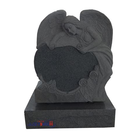 Angel Carving With Heart Shaped Headstone