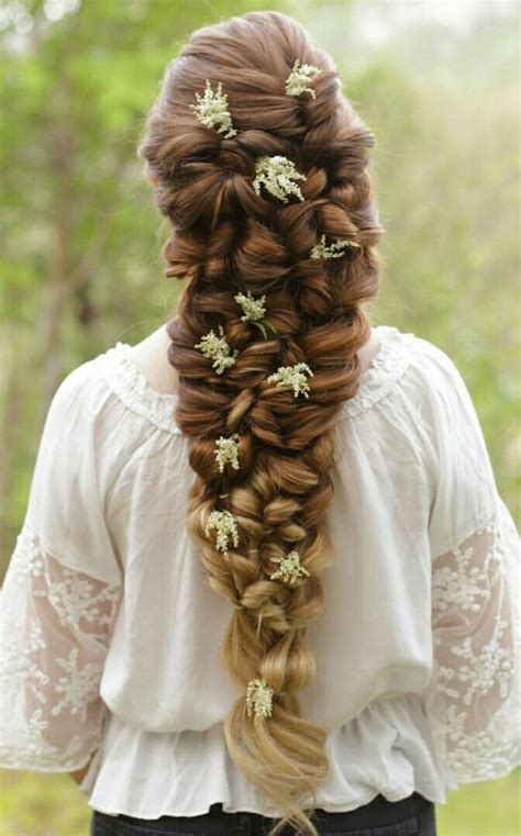 One or more flowers, living or artificial, being worn as a hair ornament. Medieval Inspired Braided Hairstyle with Flowers. So ...