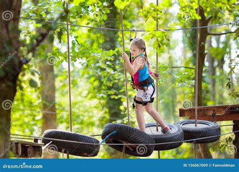 Child In Adventure Park Kids Climbing Rope Trail Stock Image Image