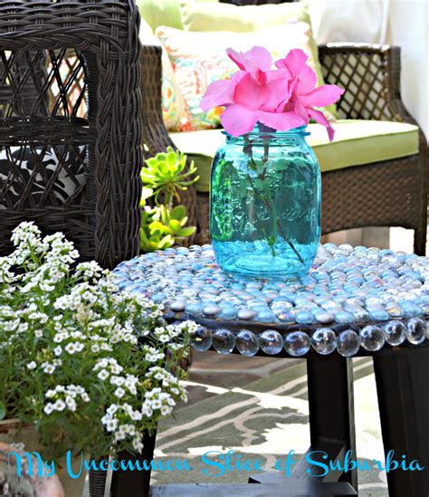 Blue planter fire bowl with river rocks DIY How to turn a stool into a outdoor glass table