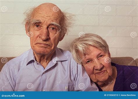 Grandma And Grandpa Cuddling Together On Couch Stock Image Image Of Husband Happiness 219263213