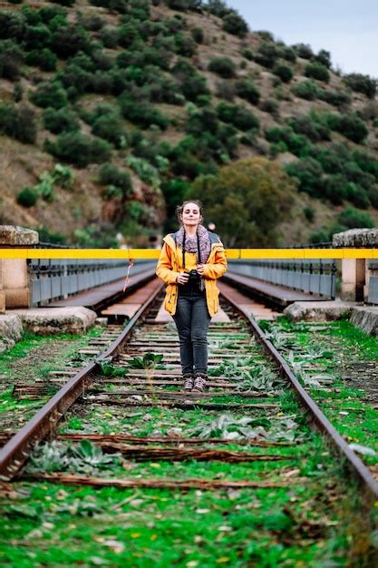 Premium Photo Portrait Of Man Standing On Railroad Track