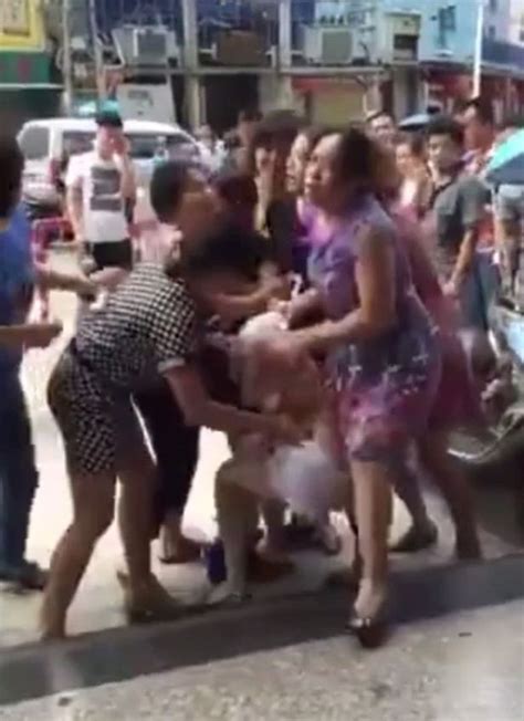 Mob Of Angry Wives Strip Mistress In Street After She Play Woman Paraded By Mob Min Video