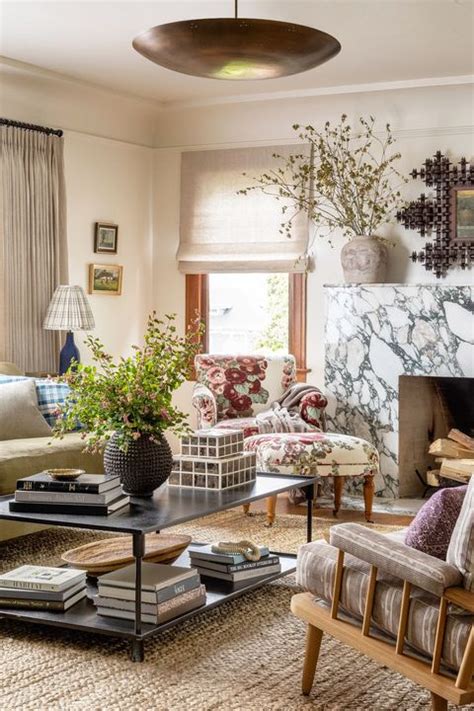 The large french windows, white trimmings on the window frames and room threshold, and the white painted ceiling, all keep this living room design feeling bright, spacious, and welcoming. The 10 Best Off-White Paint Colors for Every Room In the House