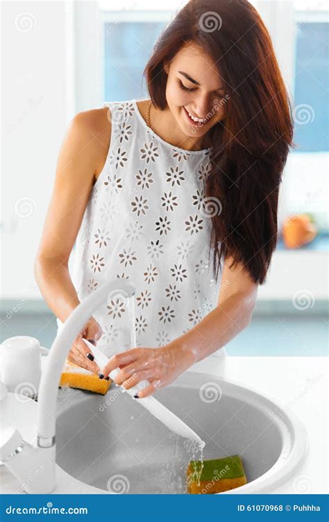 Housewife Is Washing Dishes In The Kitchen Stock Photo Image Of Indoors Household