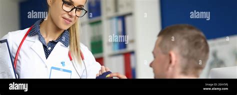 Young Female Doctor Is Helping Patient Stock Photo Alamy