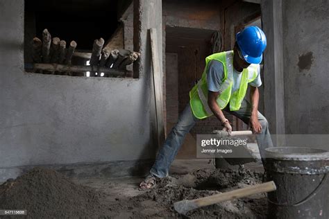 Indian Construction Worker Mixing Cement High Res Stock Photo Getty