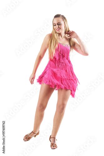 Happy Sexy Blonde Female Dancing And Touching Hair In Pink Fringed Dress Full Body Isolated On