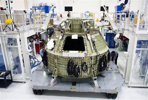 Technicians Prepare To Fit A Special Fixture Around An Orion Capsule