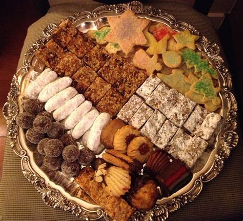 Find the perfect family baking christmas cookies stock photo. Christmas cookies platter - LOVE-the secret ingredient