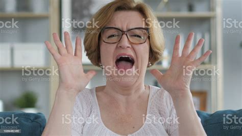 Shouting Screaming Old Woman In Anger Stock Photo Download Image Now