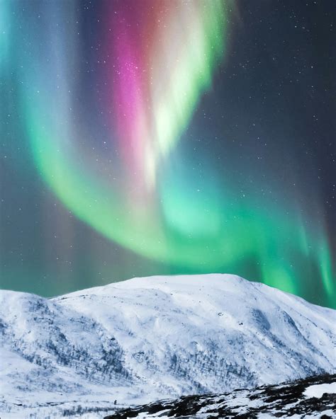 Colorful Polar Lights Over Snowy Mountain · Free Stock Photo