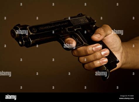 Man Holding 9mm Gun Hi Res Stock Photography And Images Alamy