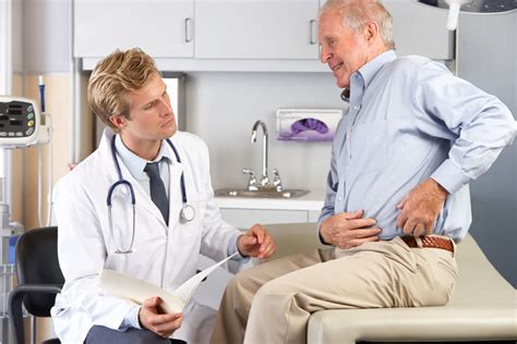 Doctor Examining Male Patient With Hip Pain Bowen Hefley Orthopedics