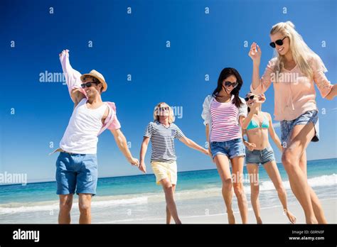 Friends Dancing On The Beach Stock Photo Alamy