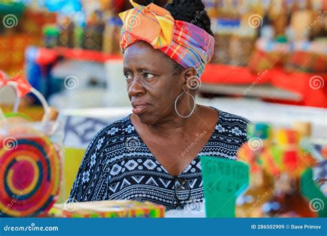 beautiful creole women in the traditional dress on the guadeloupe street editorial stock image