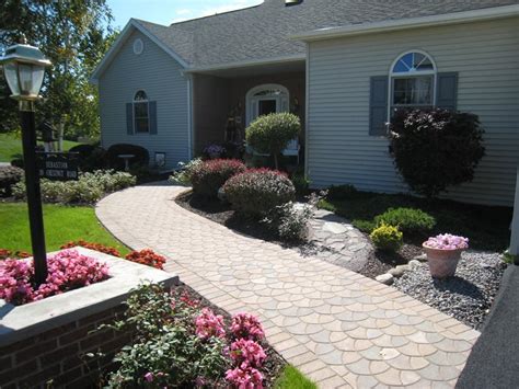 We got a truckload of free brick pavers and used them to replace the front walkway of the house. Paver Walkway - New Hartford, NY - Photo Gallery ...
