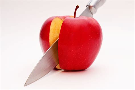 Sliced Red Apple With Gray Knife Hd Wallpaper Wallpaper Flare