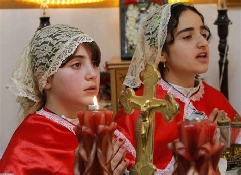 Two Young Iraqi Christian Girls Celebrate Easter Mass At The Chaldean