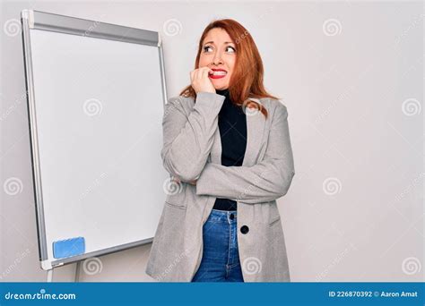 Young Beautiful Redhead Businesswoman Doing Business Presentation Using