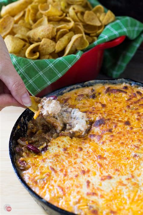 The Classic Frito Pie Dish Containing Corn Chips Chili And Cheese Is