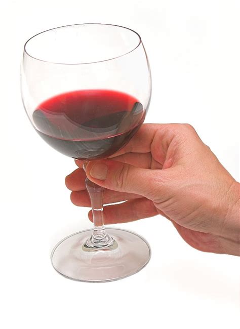 Holding it at the base will reduce impacting the temperature of your wine and smudging your glass for a more pleasurable experience. Tips for holding a wine glass | Tall Horse Wines