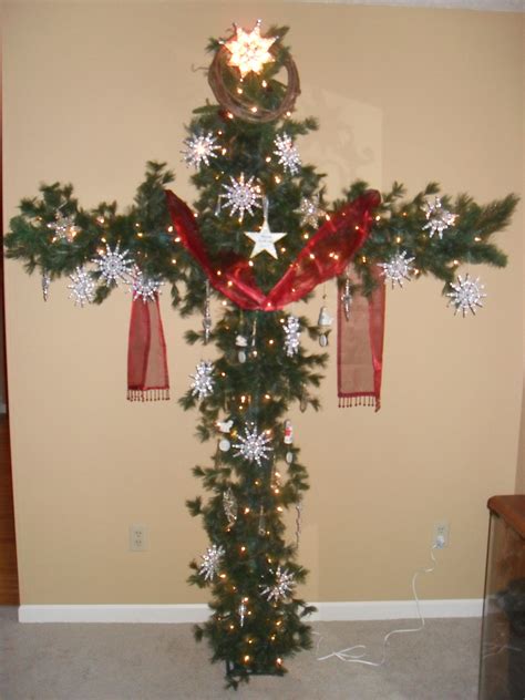 A Cross Christmas Tree Made From Pcv Pipe And Garland Red Sash