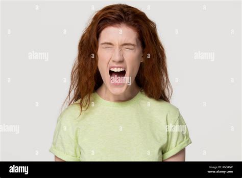 Angry Stressed Redhead Woman Screaming Yelling Loud Isolated On