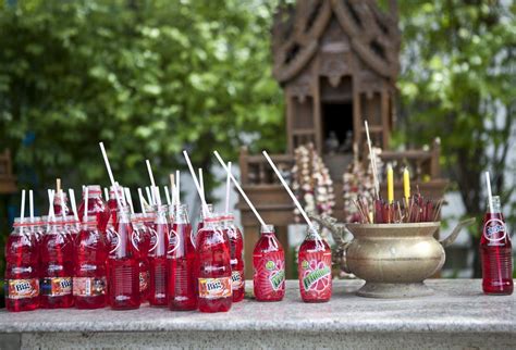 Why Do Thai Spirit Houses Have Red Fanta As Offerings By Orana