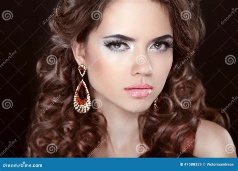 Long Hair Beautiful Brunette Girl Model With Fashion Earrings Stock