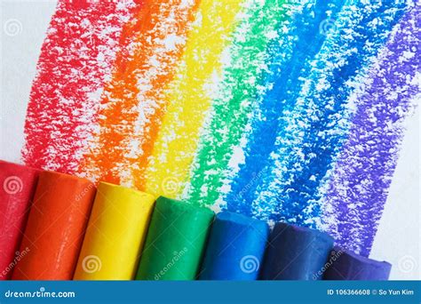 A Rainbow Drawn With Crayons And Raindrops Falling On It Royalty Free