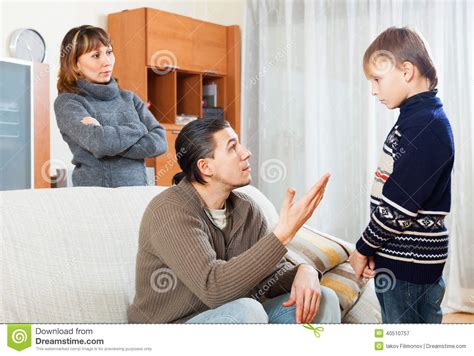 Serious Parents Berating Their Son Stock Photo Image