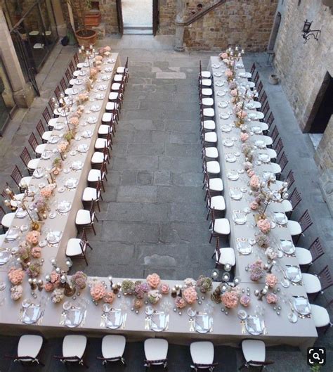 An Overhead View Of A Long Table Set Up For A Formal Function With
