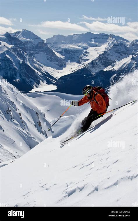 Young Man Skiing Powder At Lake Louise Ski Area Banff National Park