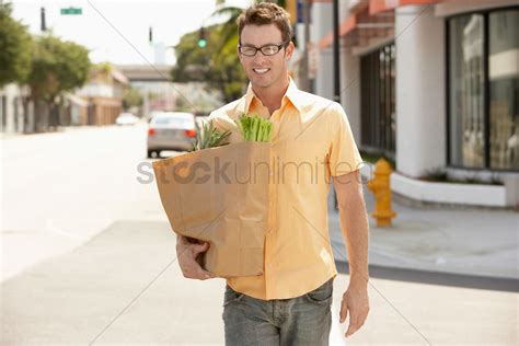Man carrying groceries after shopping portrait Stock Photo - 1885387 ...