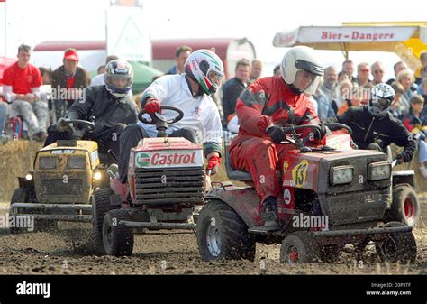 Motor Sports Fans Race With Their Tuned Lawnmowers At The Lawnmower