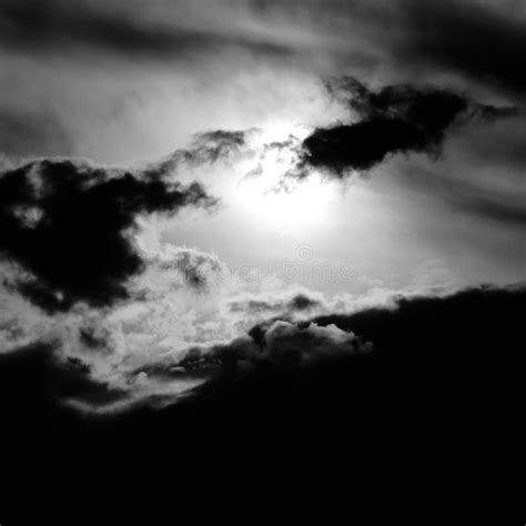 A Dramatic Silhouette Of Dark Clouds In A Misty Sky Stock Photo Image