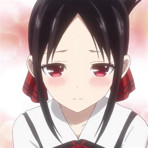 An Anime Character With Black Hair And Red Eyes