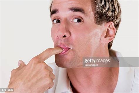 Man Licking Finger Photos Et Images De Collection Getty Images