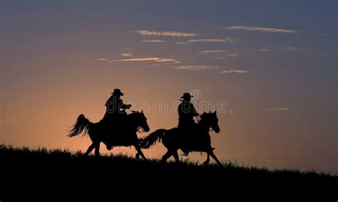 Two Cowboys On Horseback Against Dawn Sky Stock Image Image Of