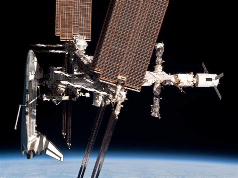 Nasa The International Space Station And The Docked Space Shuttle